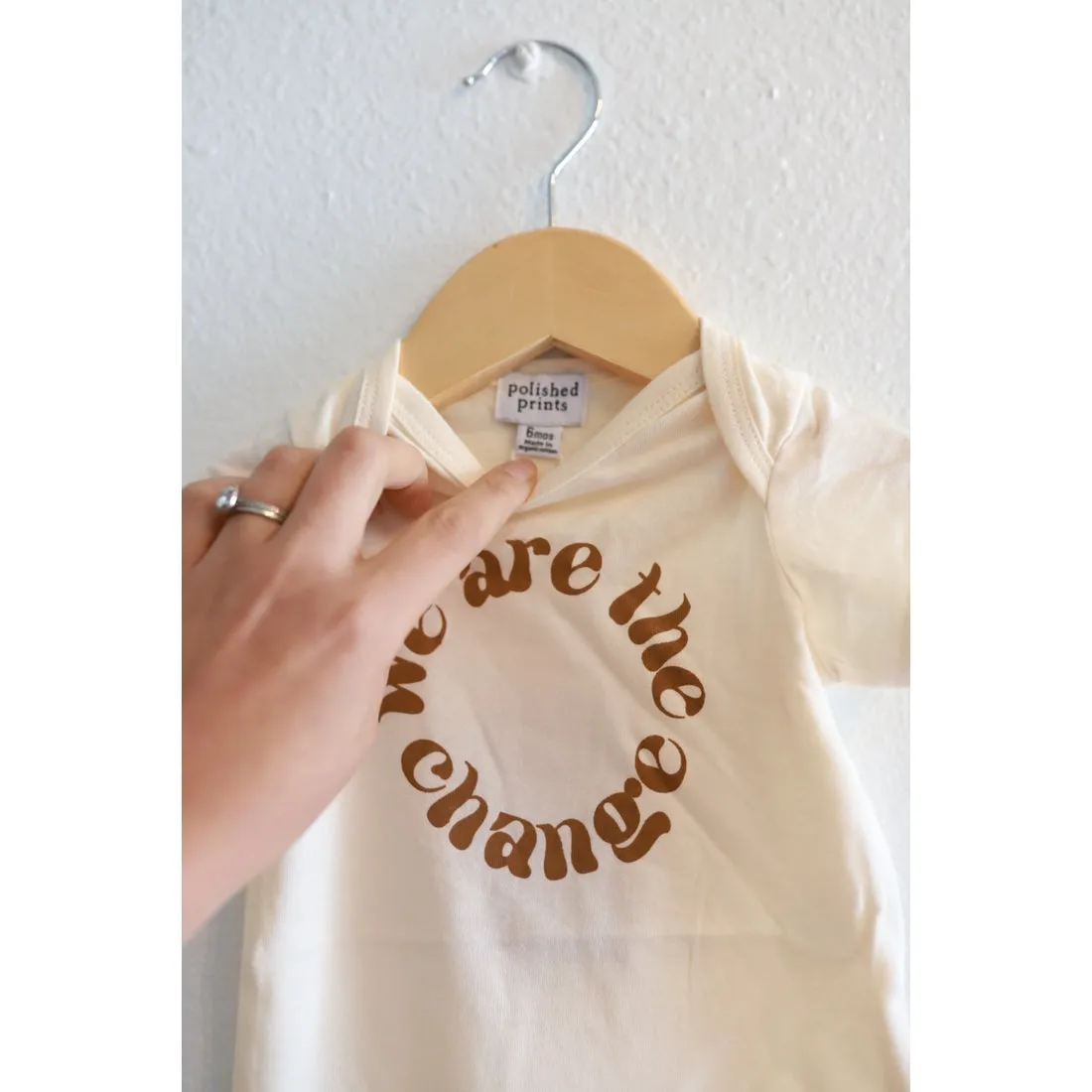 We Are the Change Infant Onesie